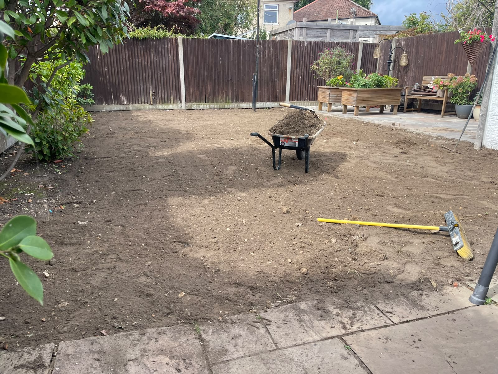 Bare soil and cleared ground before the new lawn was laid
